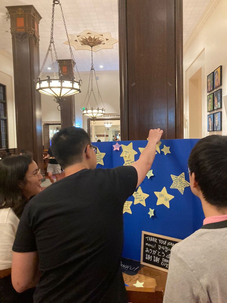 Residents adding gratitude statements to the star board
