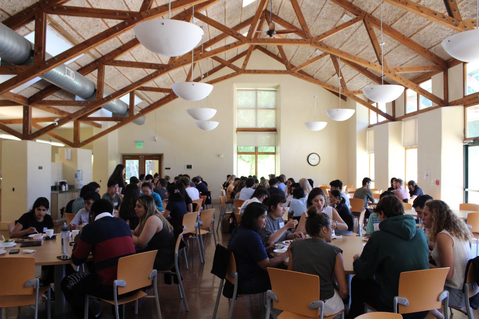 Residents at the retreat are having lunch in the dining hall.