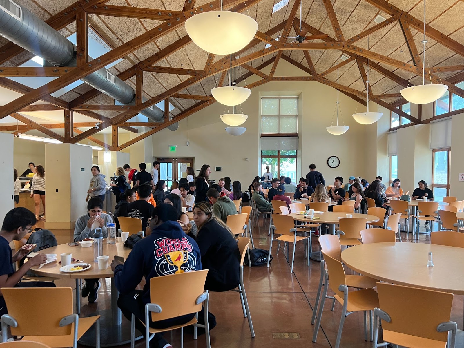 Residents at the retreat are having breakfast in the dining area.