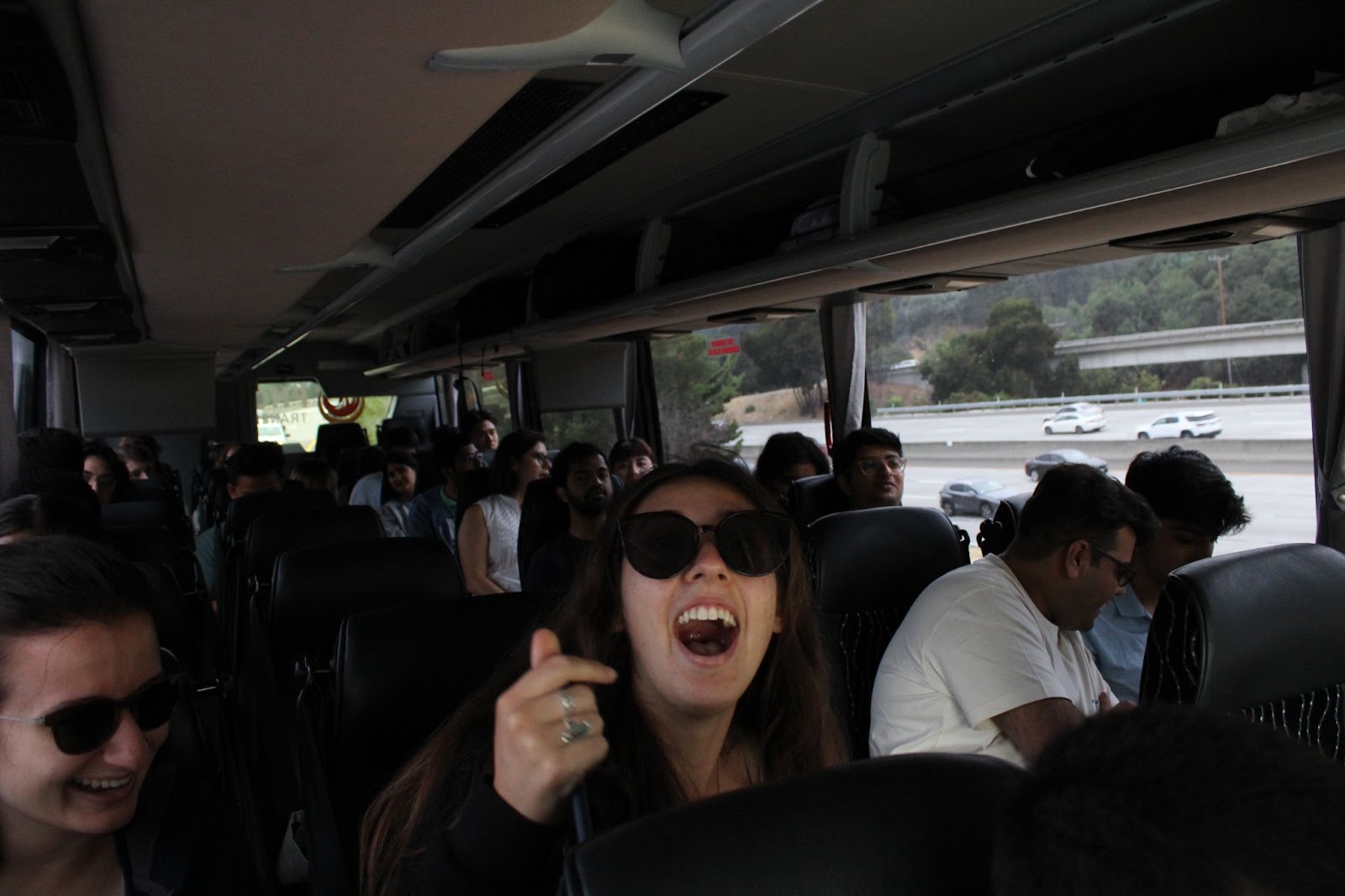 Residents are traveling in the bus. The first subject is excited.