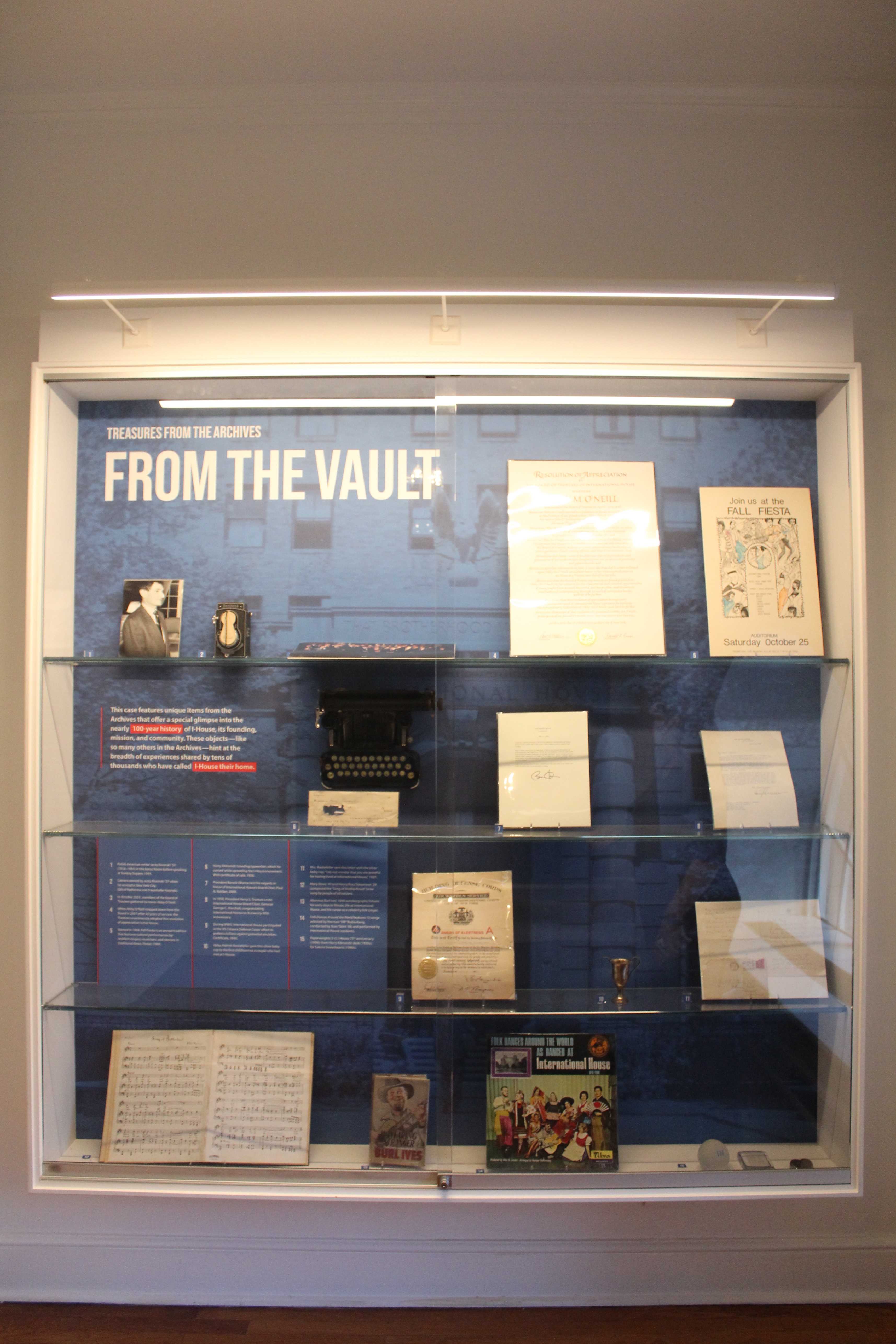 A display of archival artifacts. the Display reads "From the Vault"