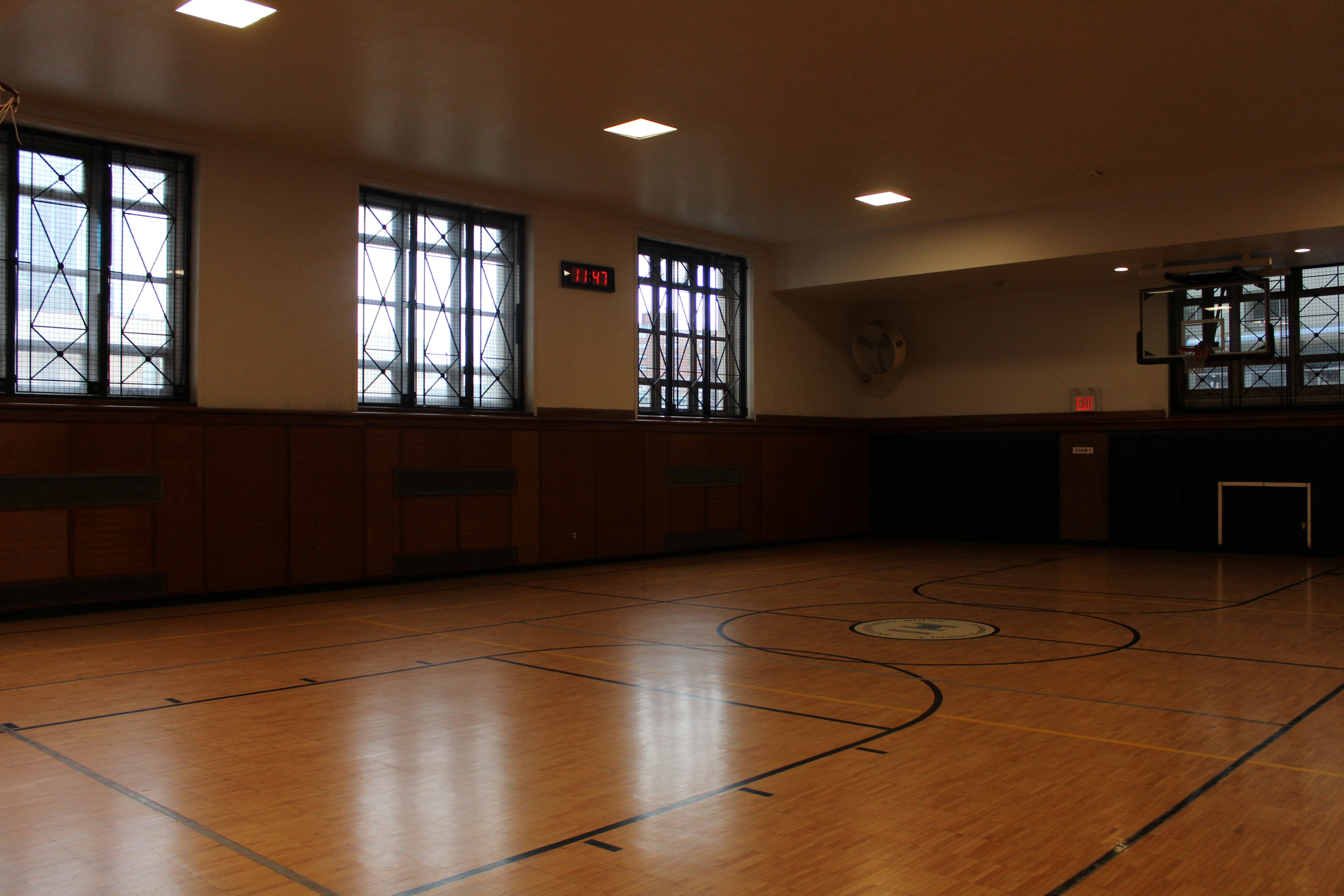 A hardwood basketball court. 