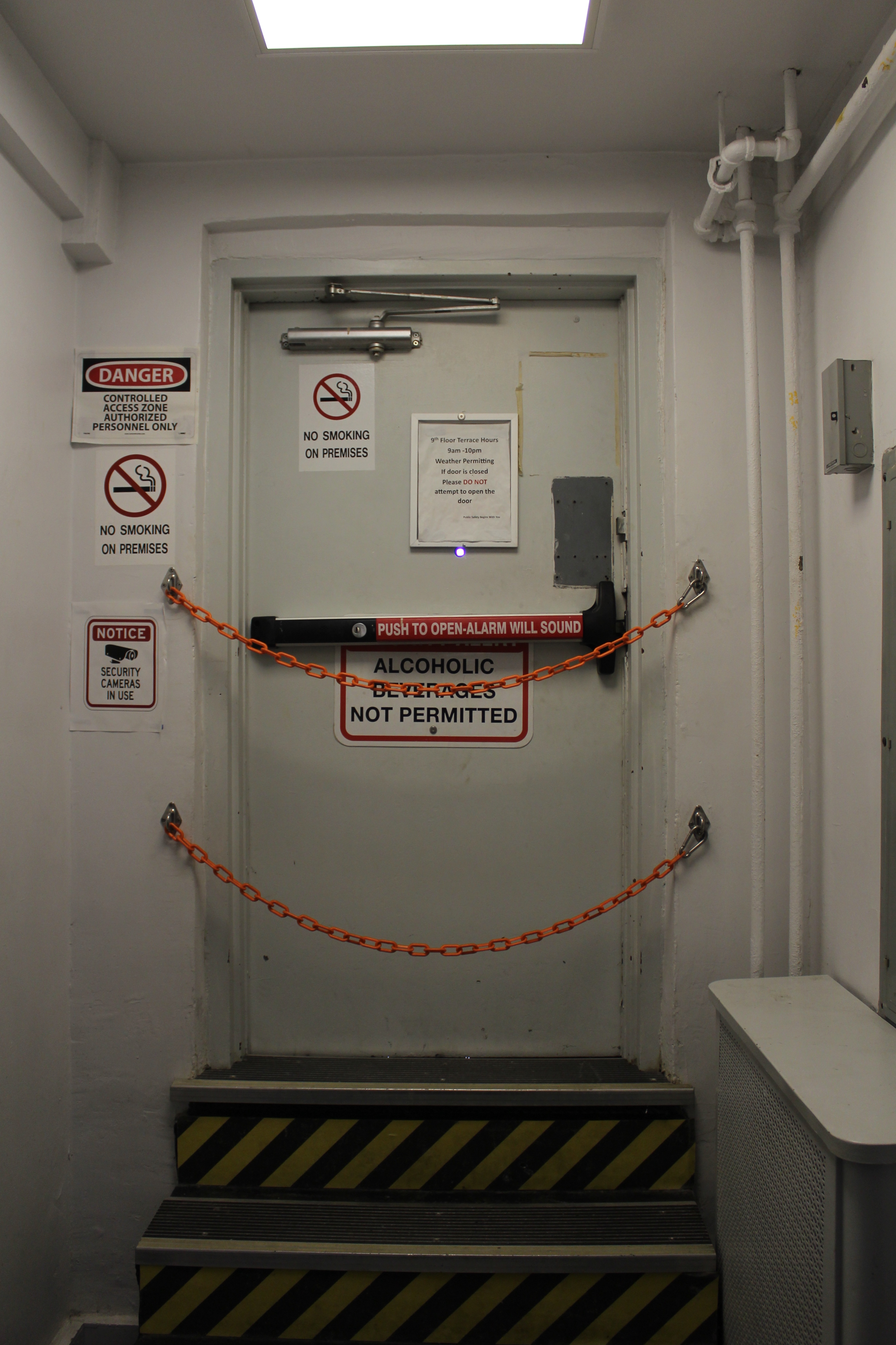 A door with profligate signage warning that entry is prohibited.