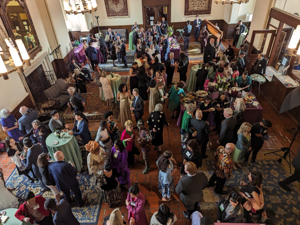Gala reception in the Great Hall showing guests mingling and listening to piano.
Photo by Laurel Anderson-Malinovsky