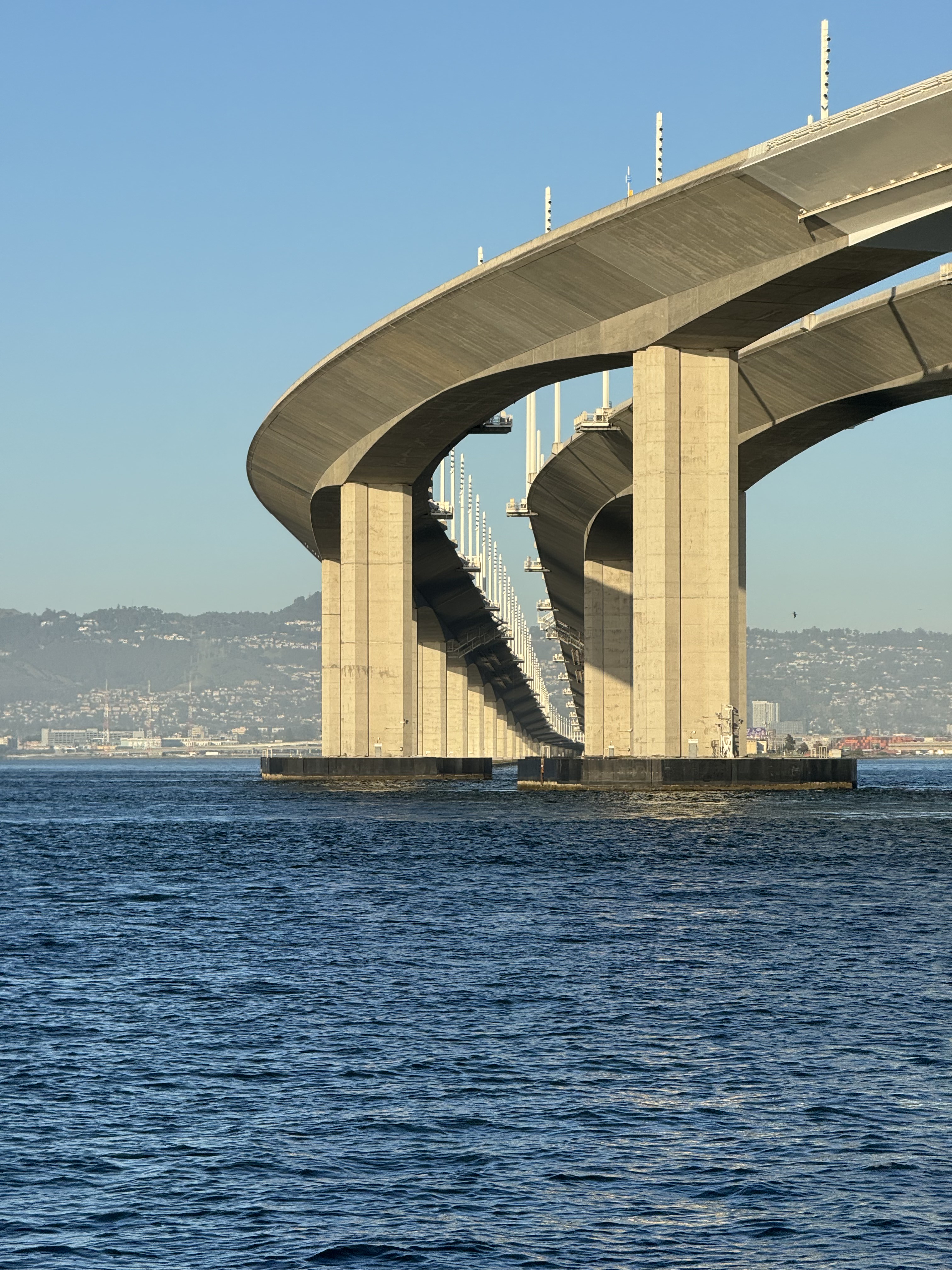 A view of the Oakland Bay Bridge from the water.